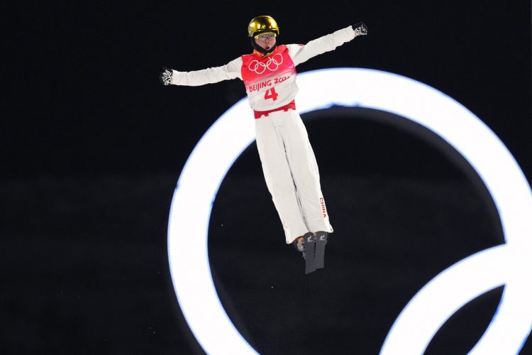 China's Qi flips his way to gold in aerials